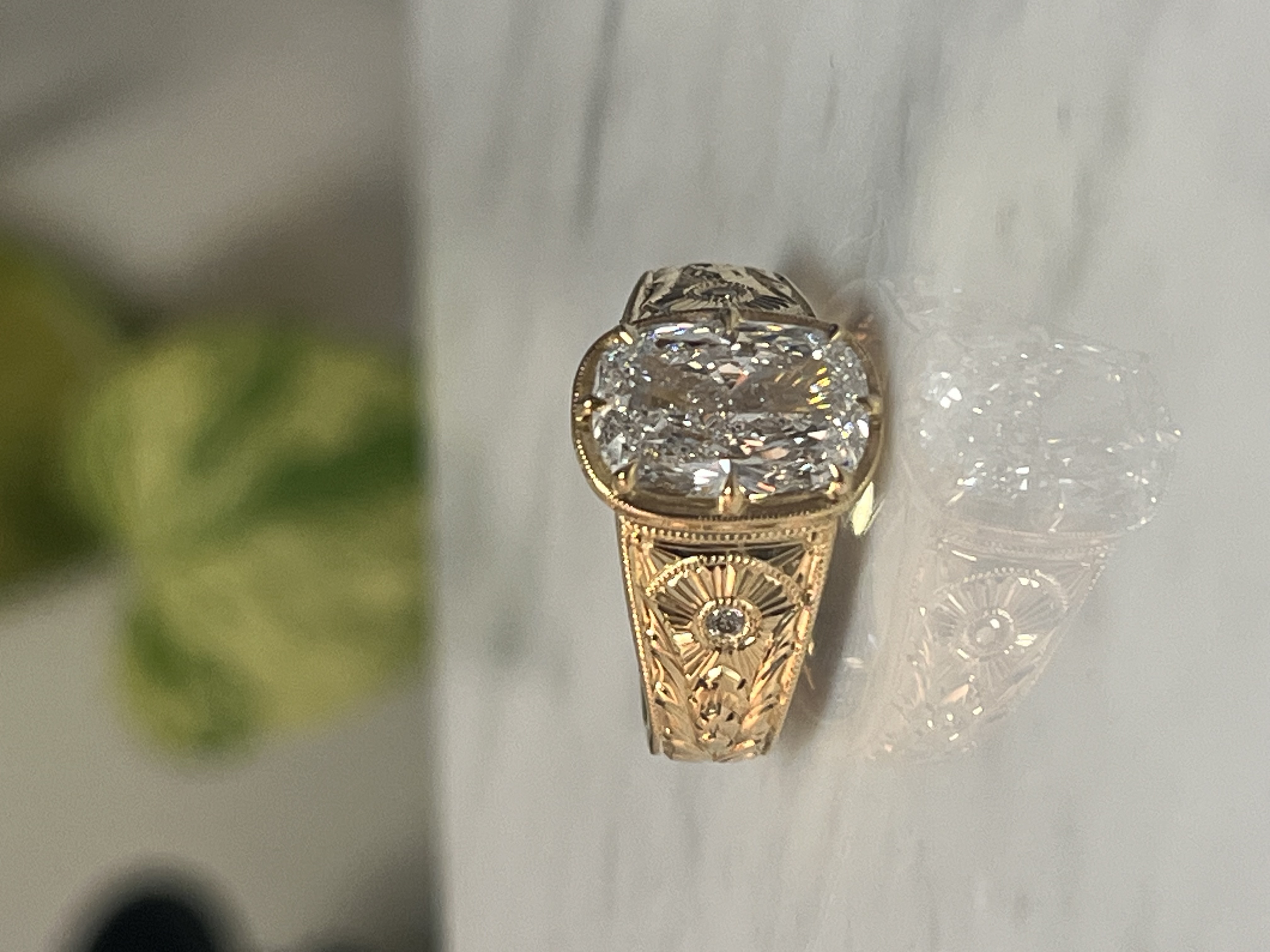 Custom cushion diamond engagement ring with deeply hand-engraved shank — Toronto goldsmith