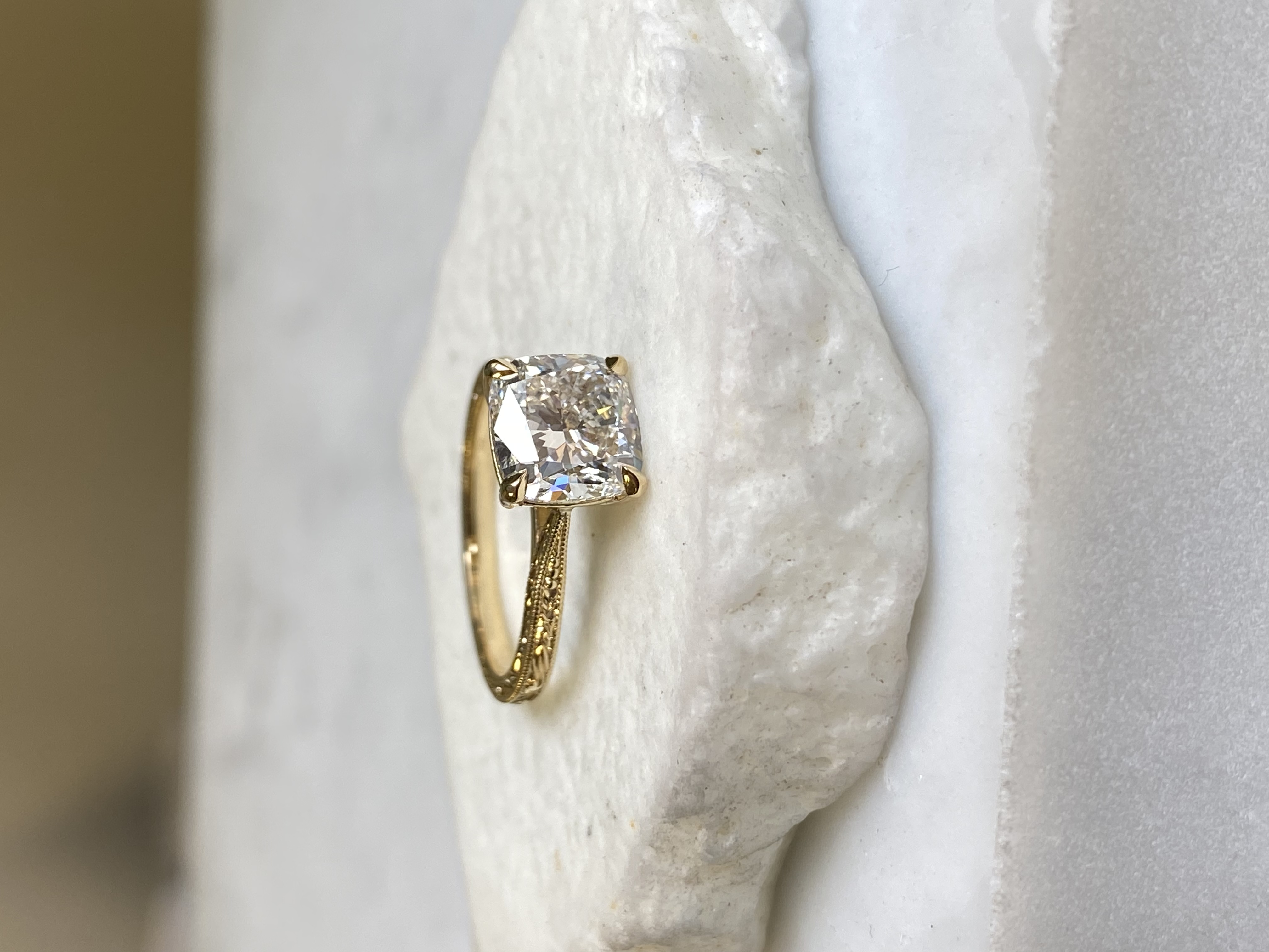 Cushion diamond solitaire with hand-engraved band on stone — Toronto goldsmith