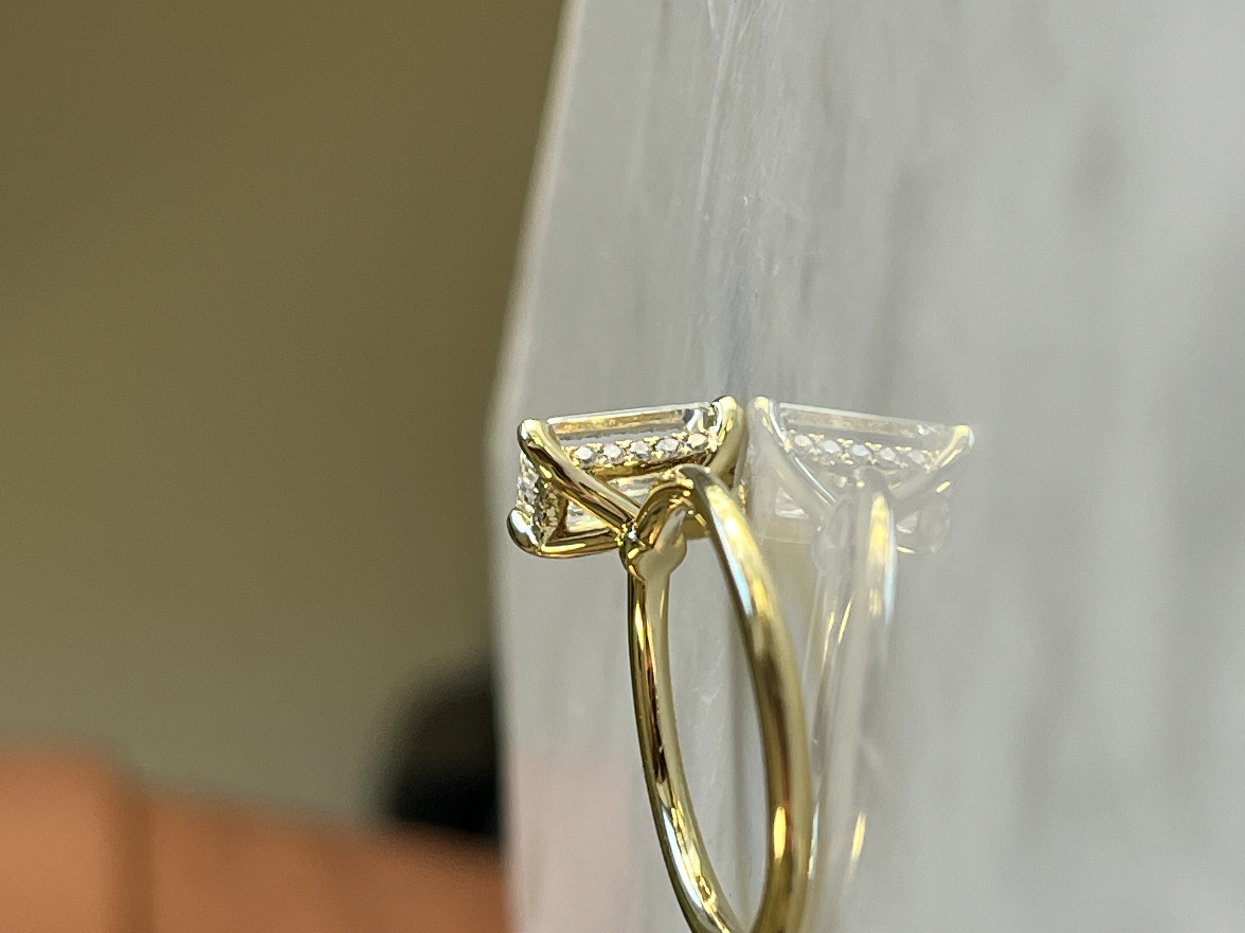 Emerald cut solitaire side view — Bear Goldsmithing Toronto