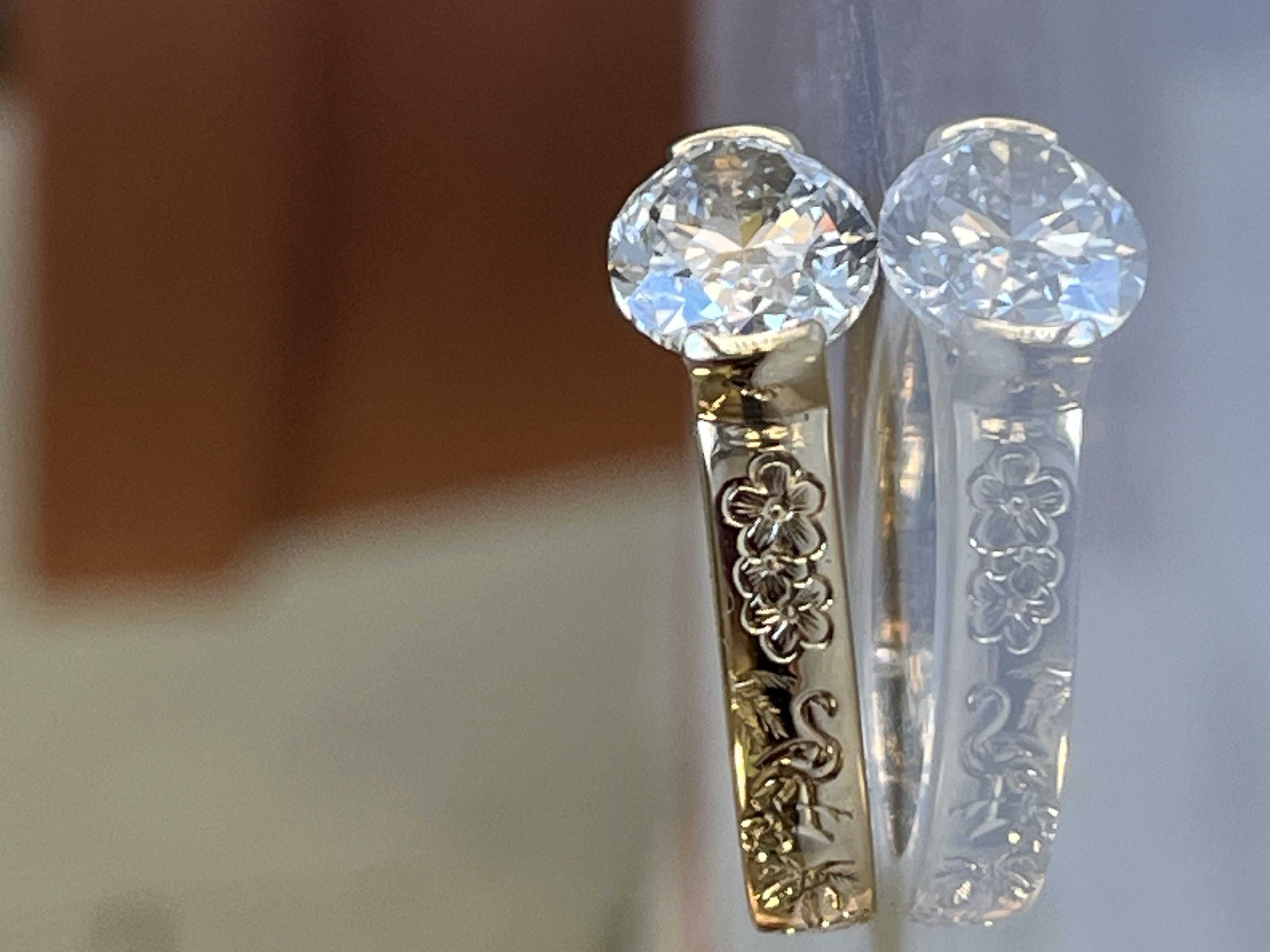 Round brilliant diamond bezel engagement ring with floral hand-engraved band — custom ring Toronto