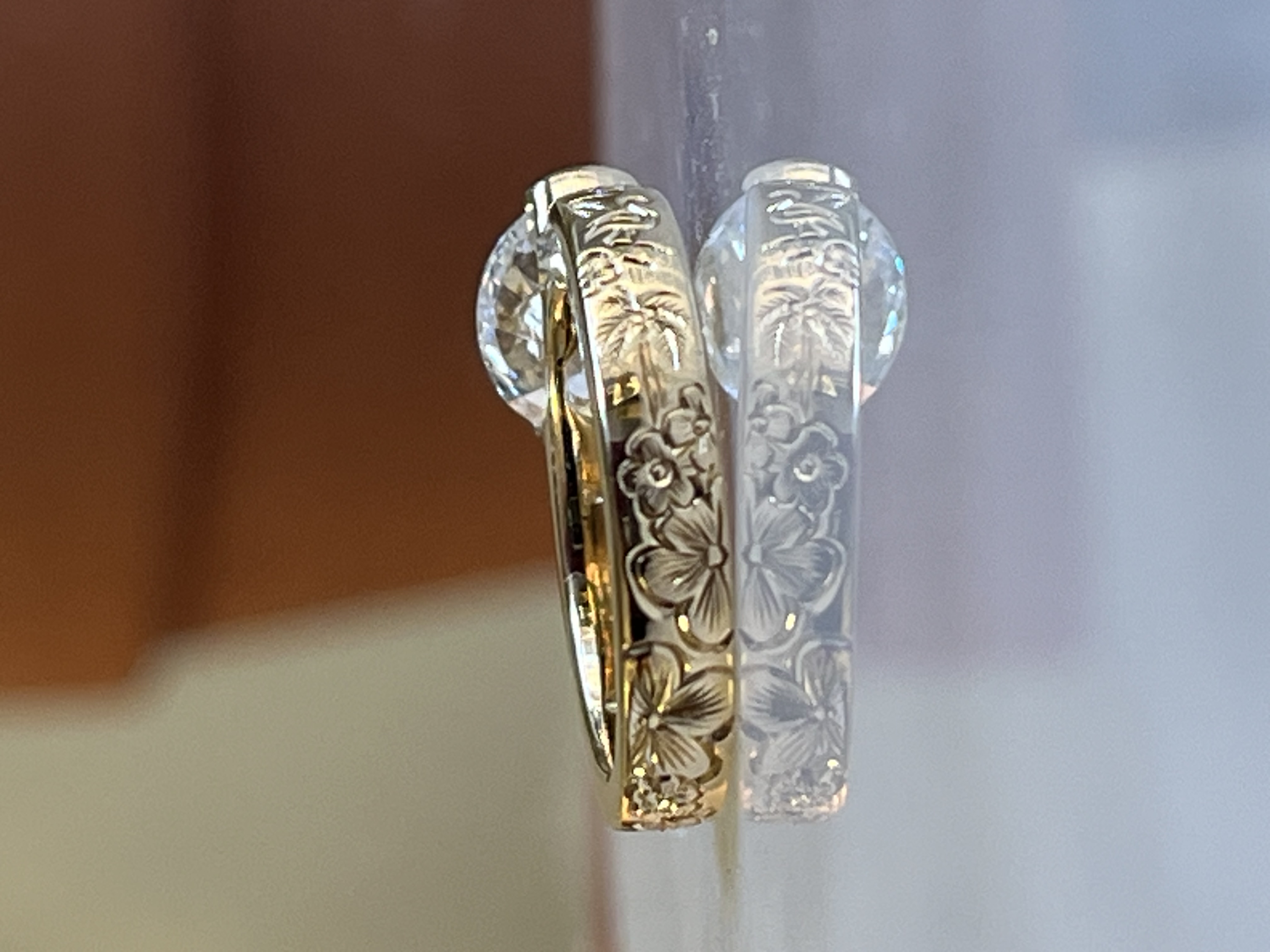 Cherry blossom hand-engraved band on oval diamond engagement ring — Toronto goldsmith