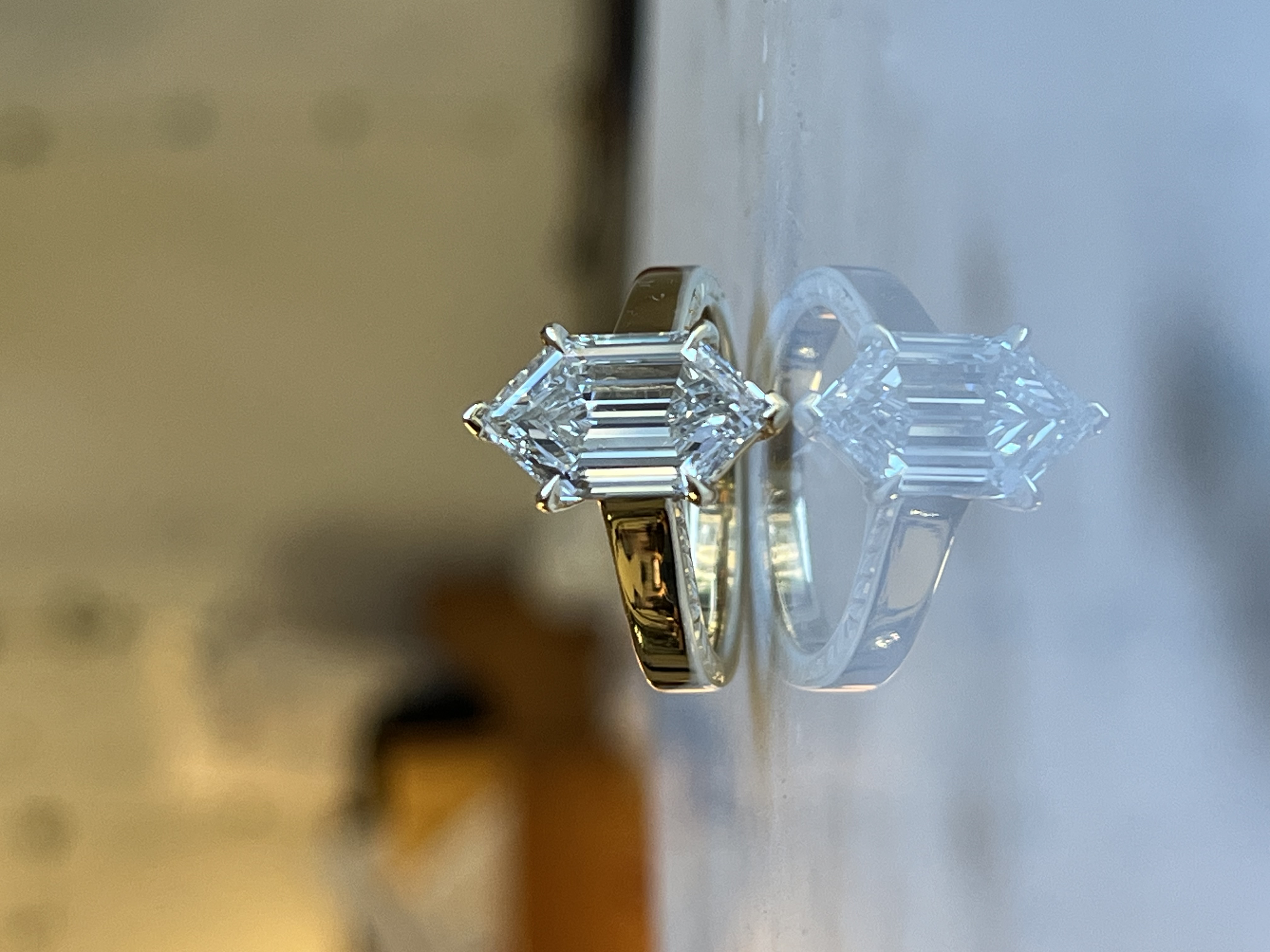 Hexagonal diamond solitaire with hand-engraved feather leaf accent shoulders in 14k two-tone gold — Bear Goldsmithing Toronto