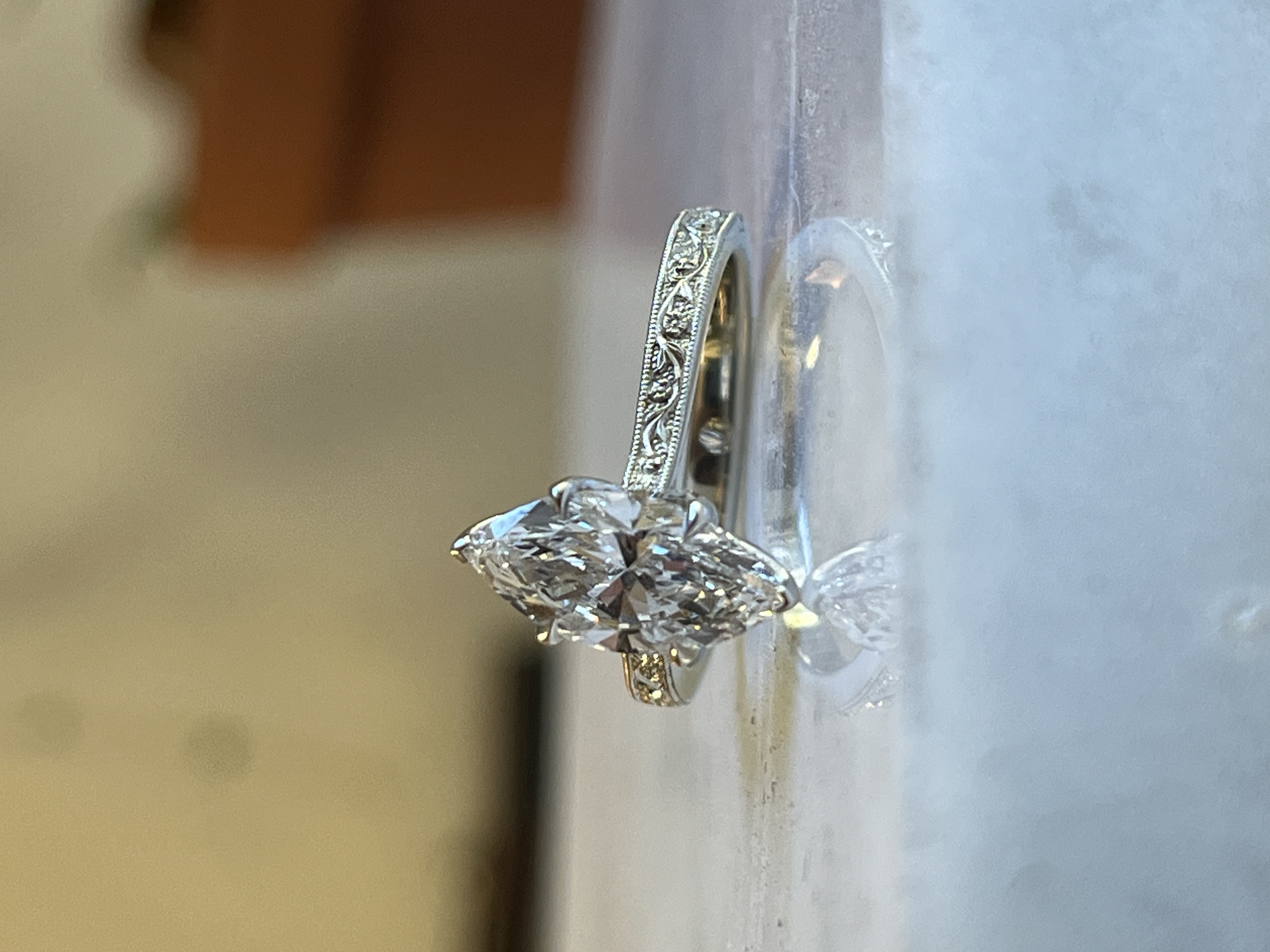 Side view of hexagonal marquise ring with engraved shank — bespoke engagement ring Toronto