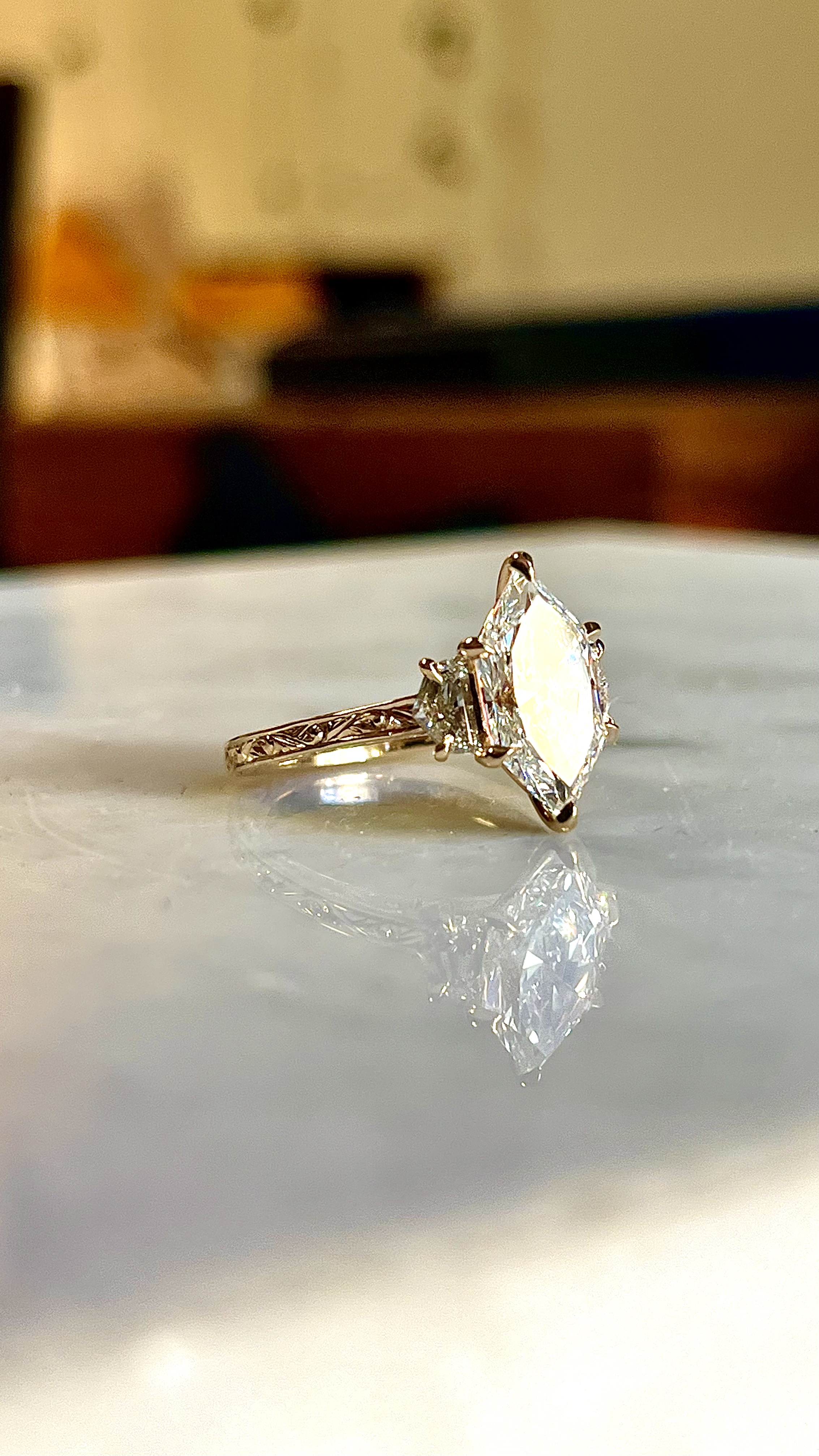 Fully hand-engraved arabesque scrollwork marquise three-stone hexagonal engagement ring — Bear Goldsmithing Toronto