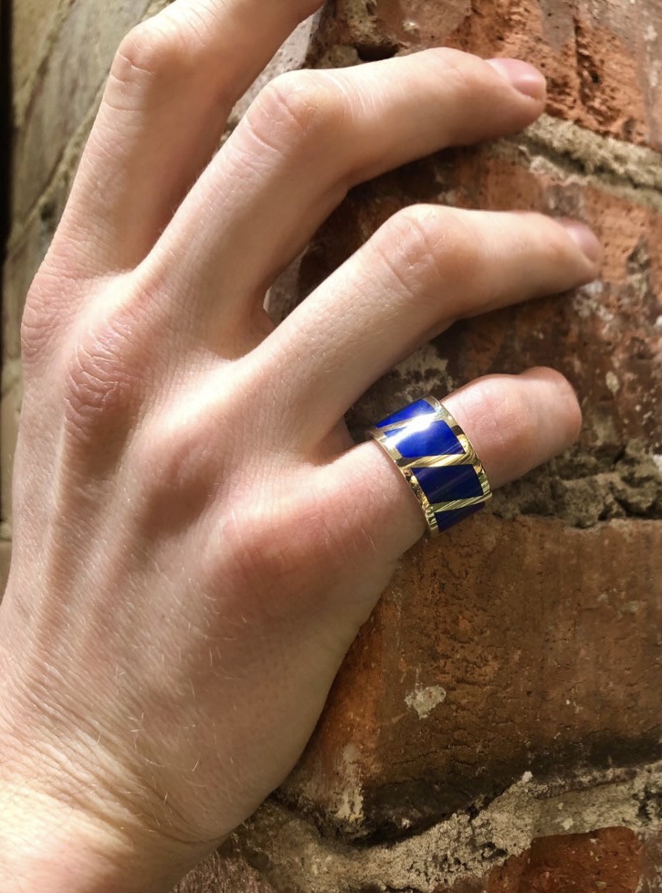 Lapis lazuli inlay mens ring worn on hand against brick wall — Bear Goldsmithing Toronto