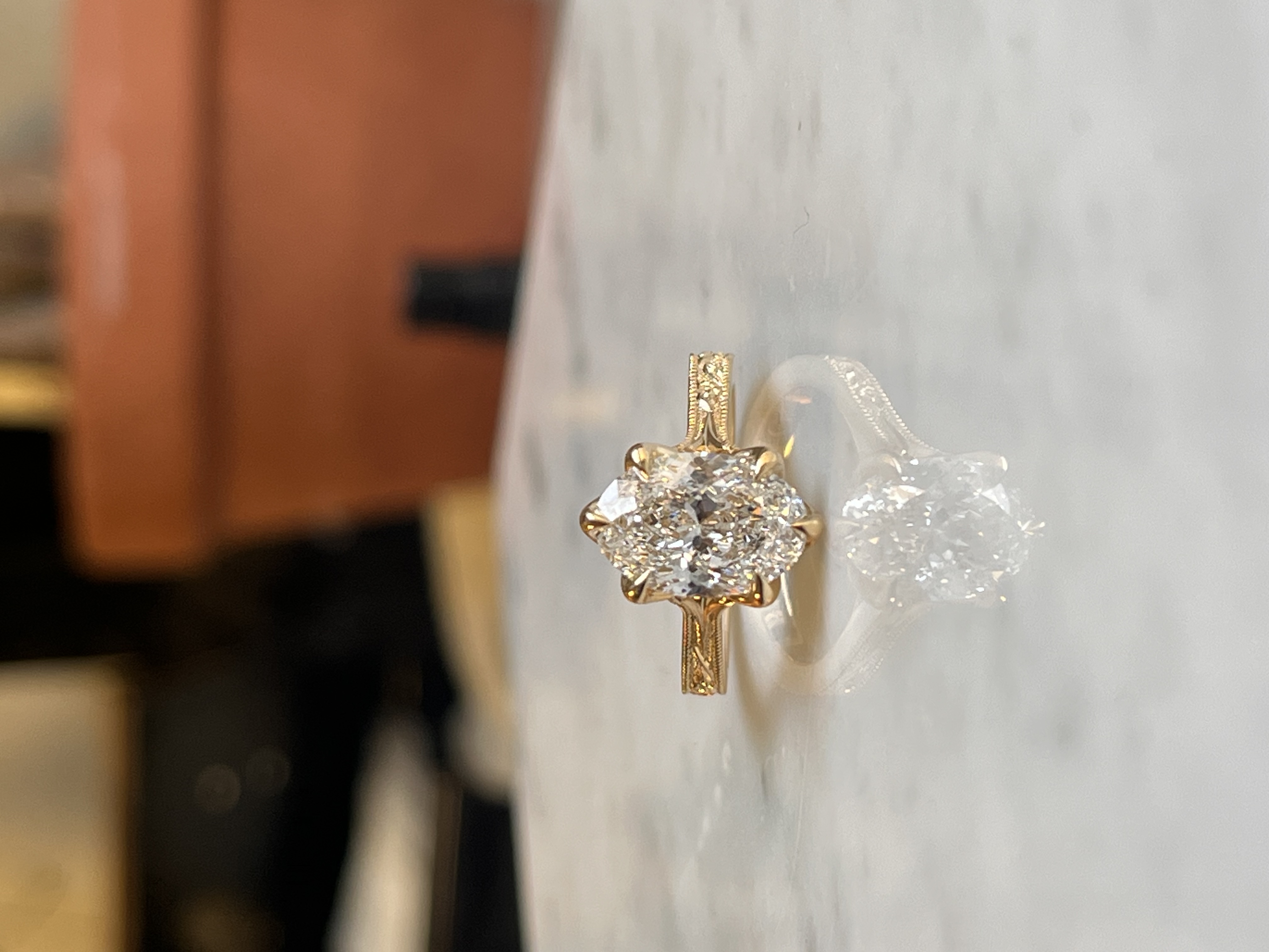 Floral vine engraving detail — oval diamond solitaire Toronto