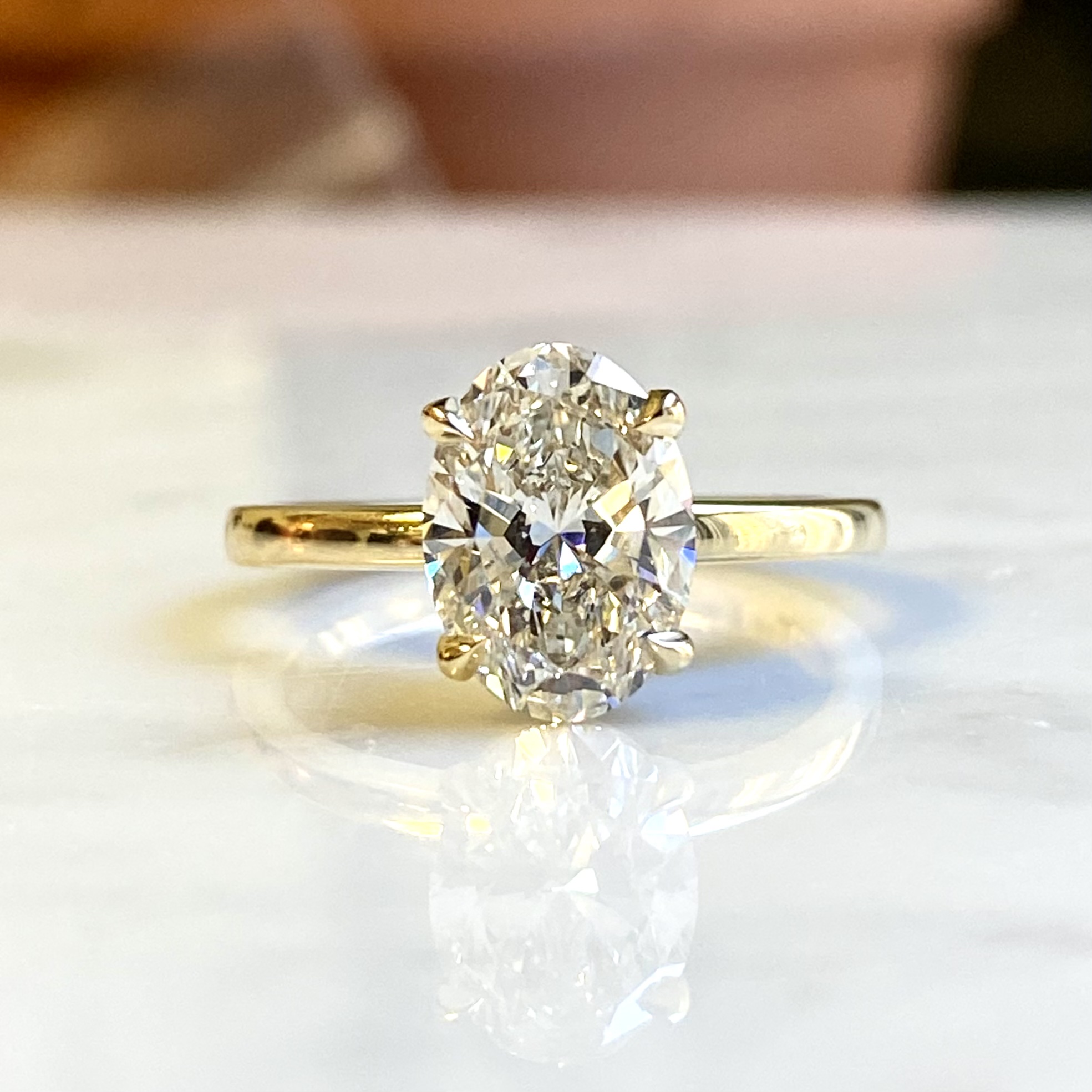 Oval diamond solitaire plain band yellow gold — Bear Goldsmithing Toronto