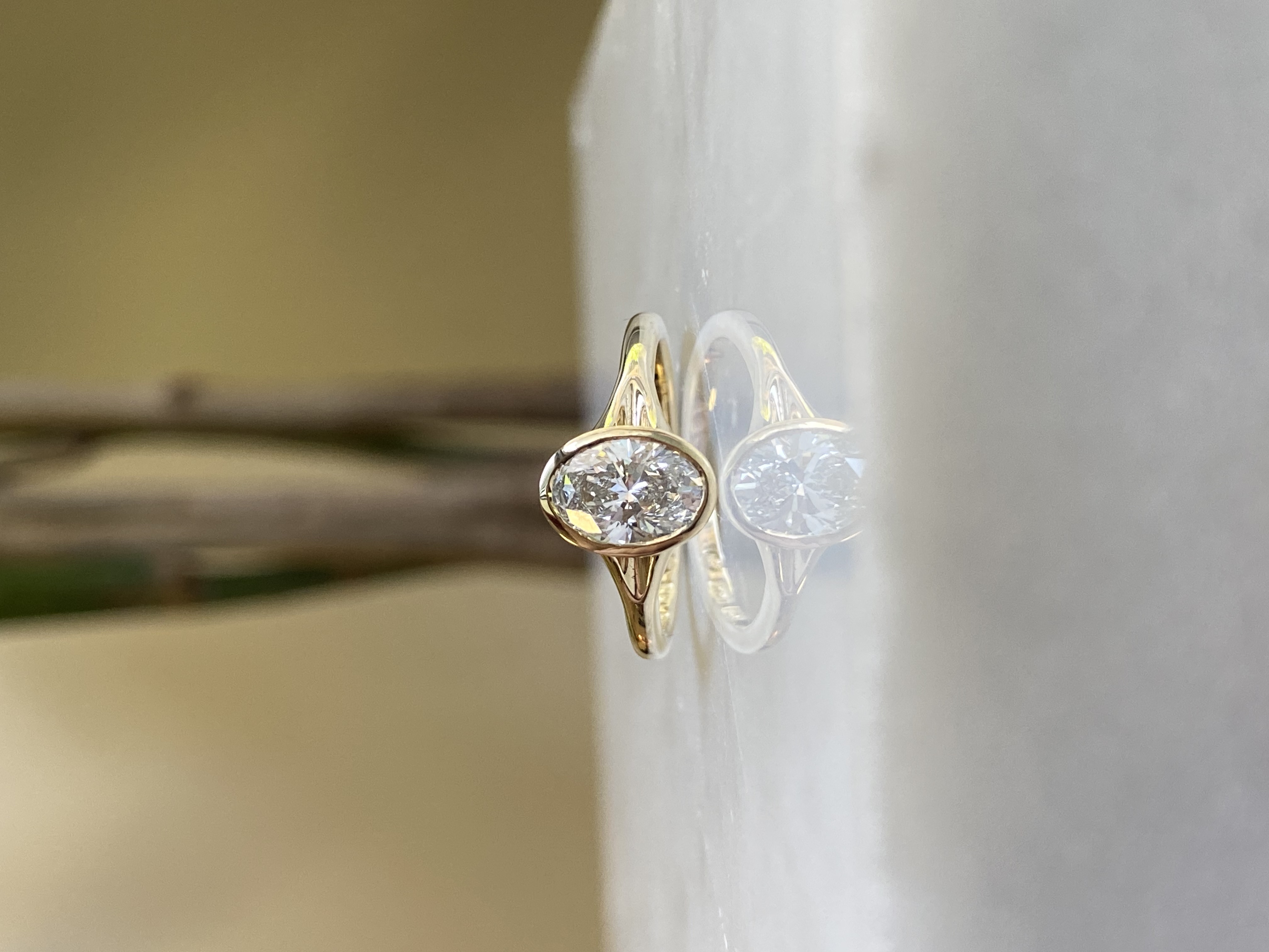 1ct oval diamond thin bezel split shank yellow gold engagement ring — Bear Goldsmithing Toronto
