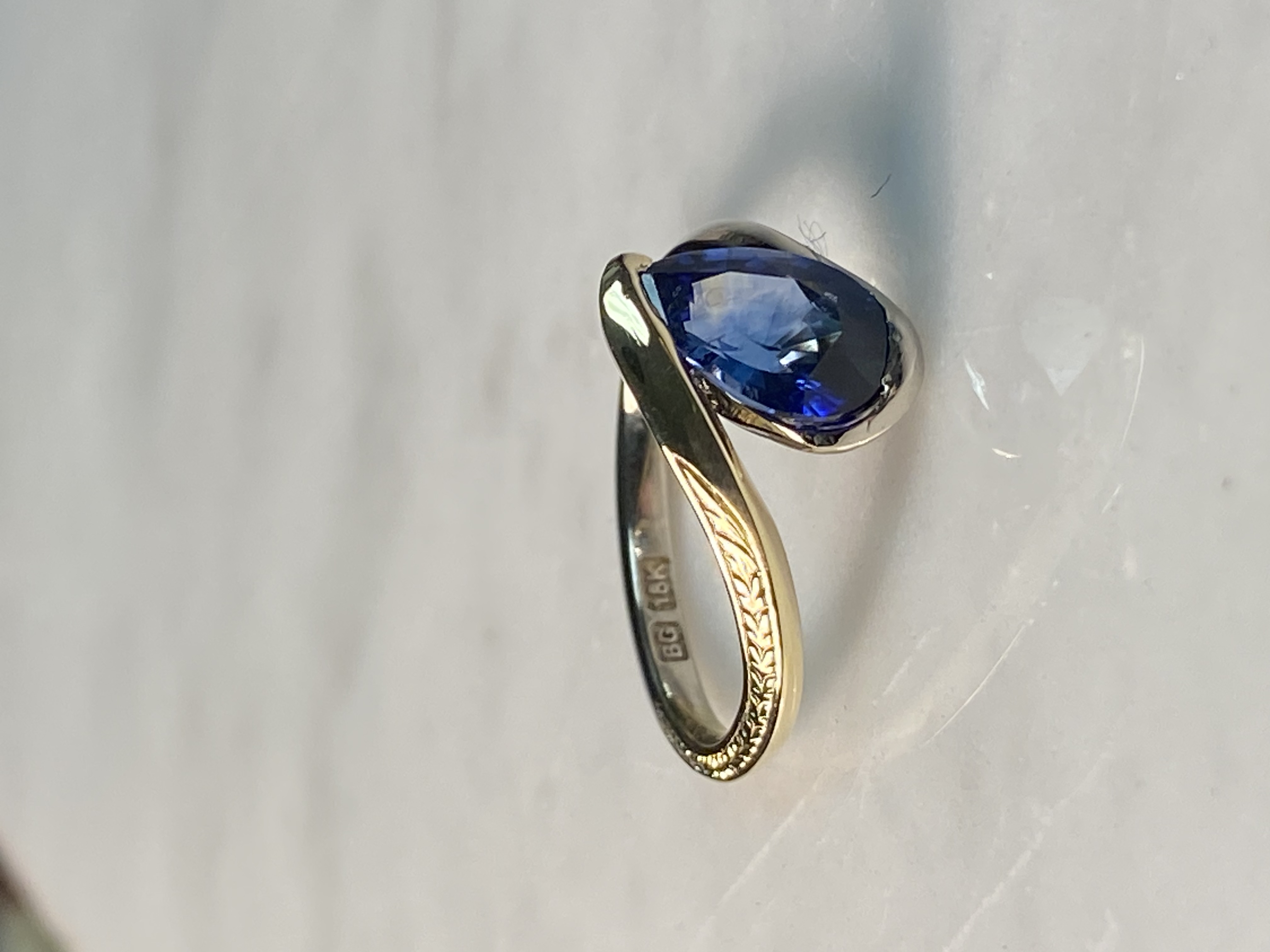 Pear sapphire bypass engagement ring 18k two-tone gold hand-engraved wheat shank — Bear Goldsmithing Toronto