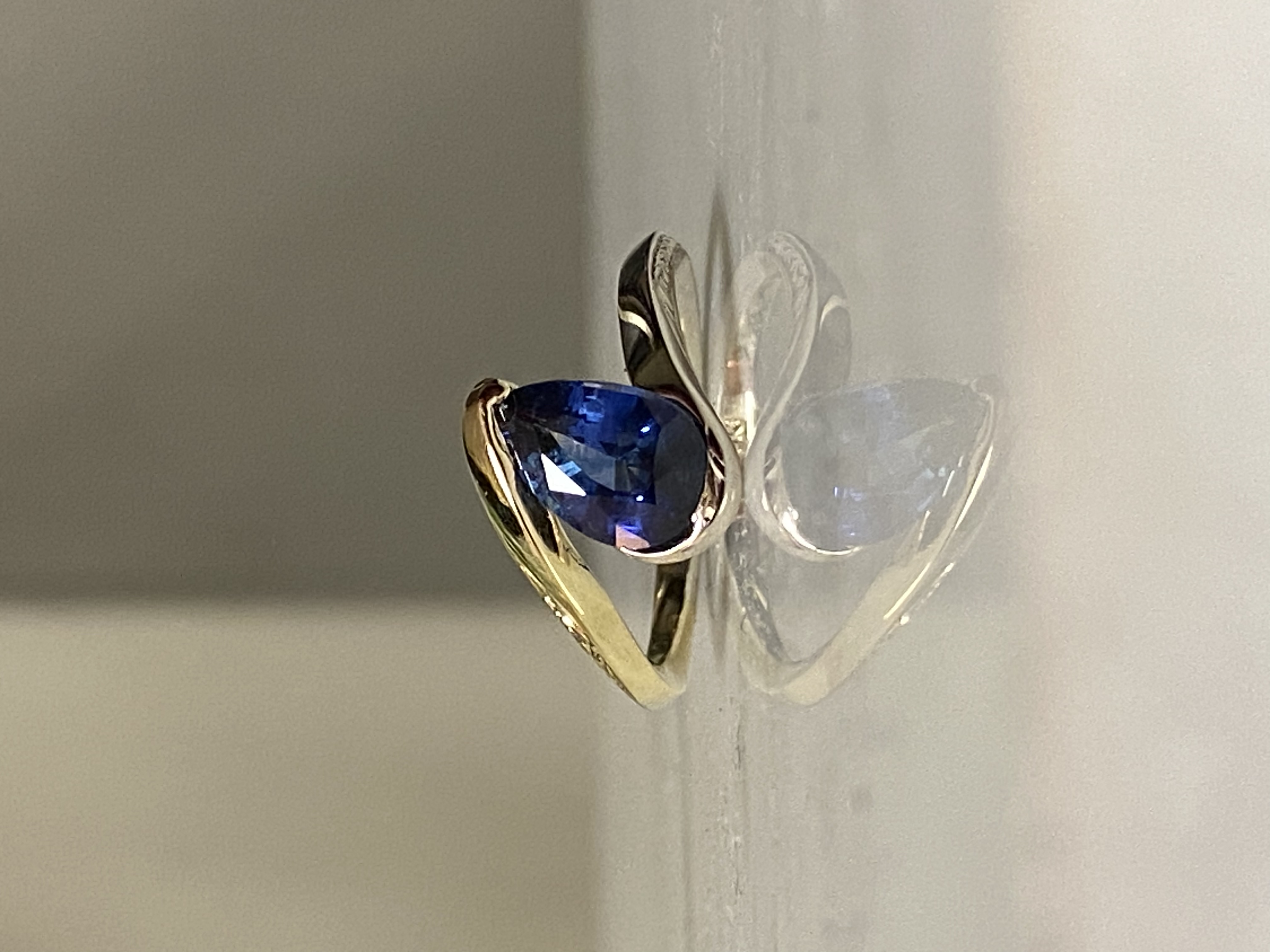 Pear sapphire bypass engagement ring in 18k two-tone gold with hand-engraved wheat shank — Bear Goldsmithing Toronto