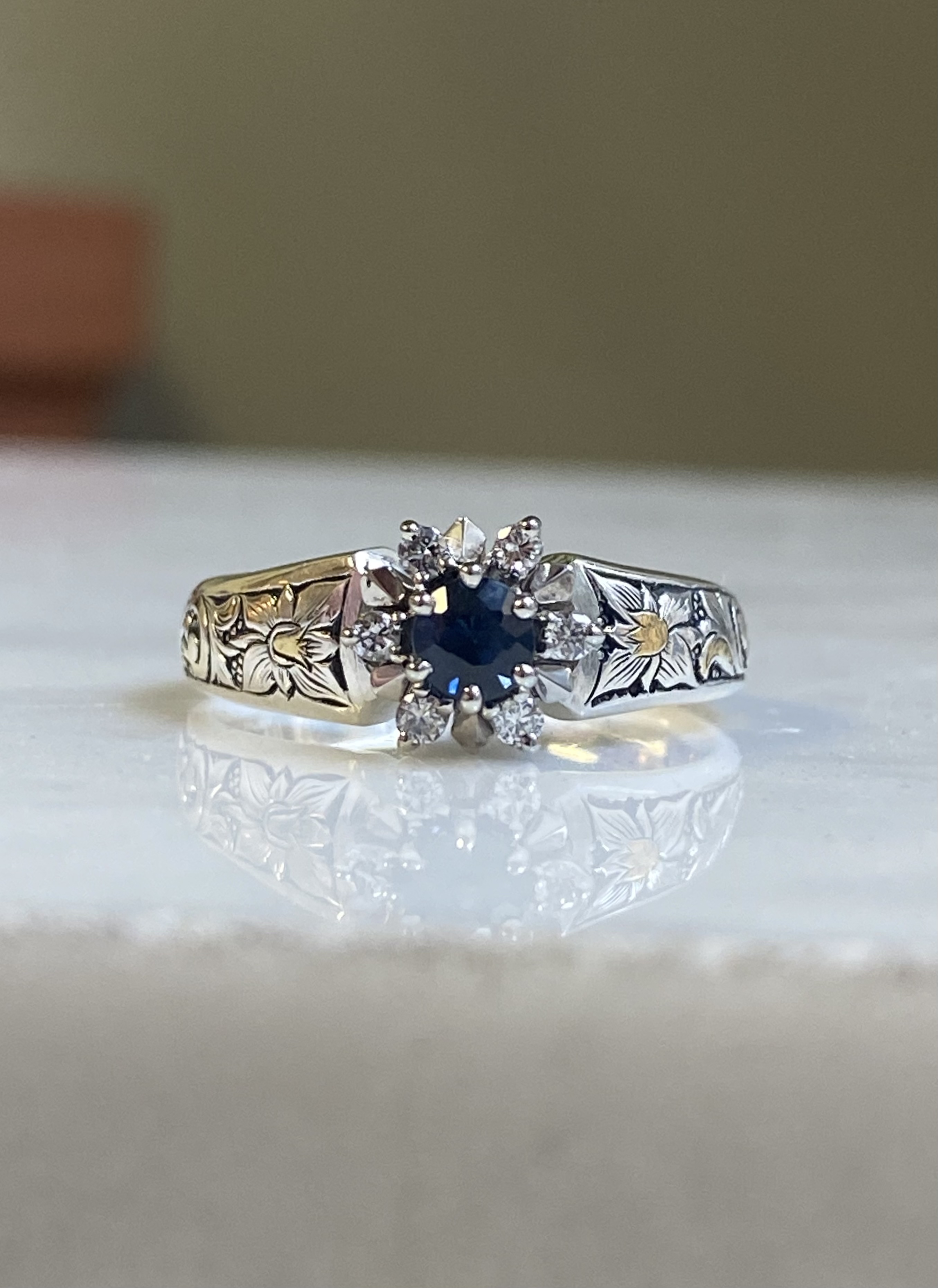 Vintage white gold sapphire and diamond cluster ring with hand-engraved silver band and 24k yellow gold inlay floral motifs — Bear Goldsmithing Toronto