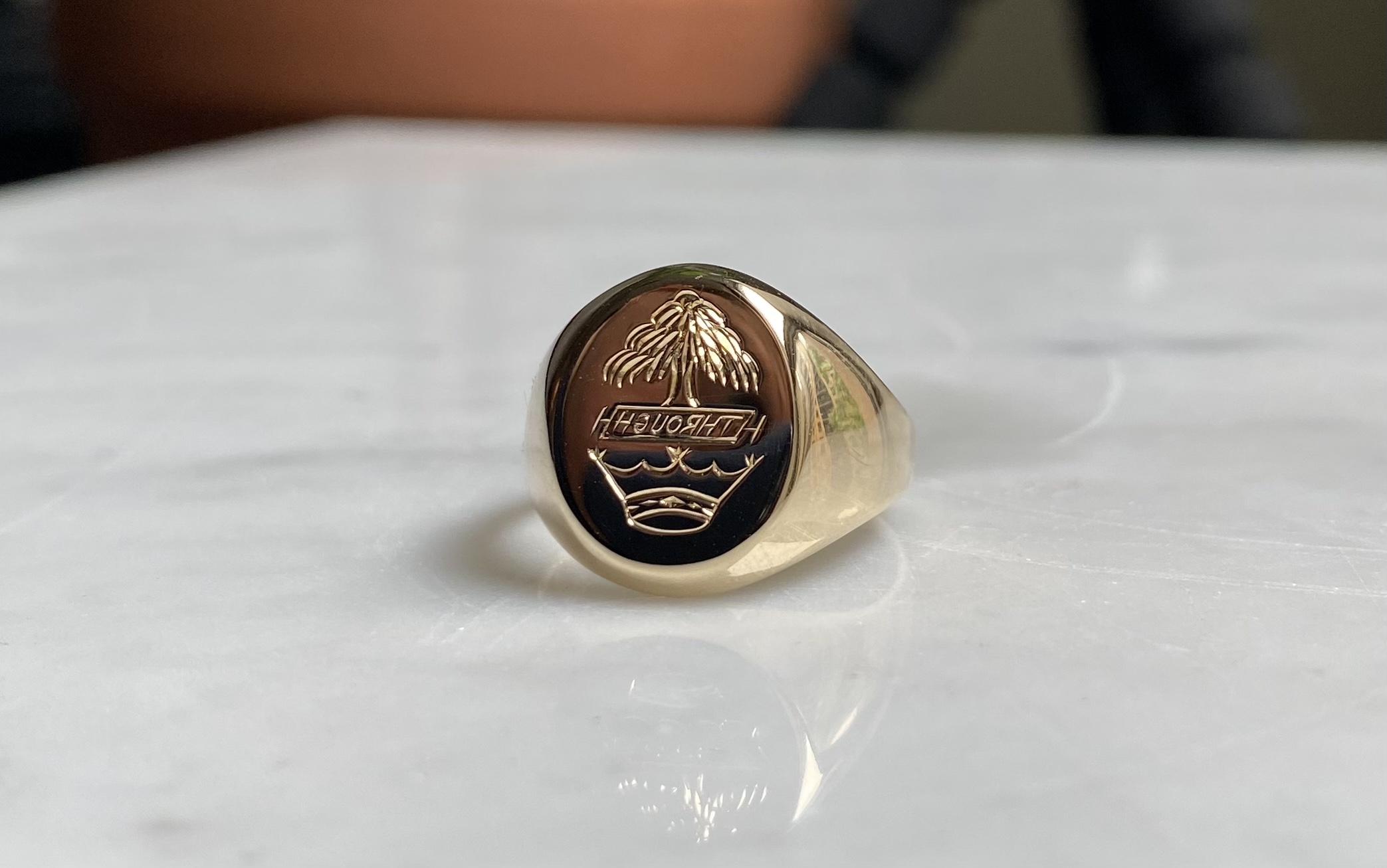 Heraldic crest intaglio signet ring in yellow gold — family crest engraving Toronto