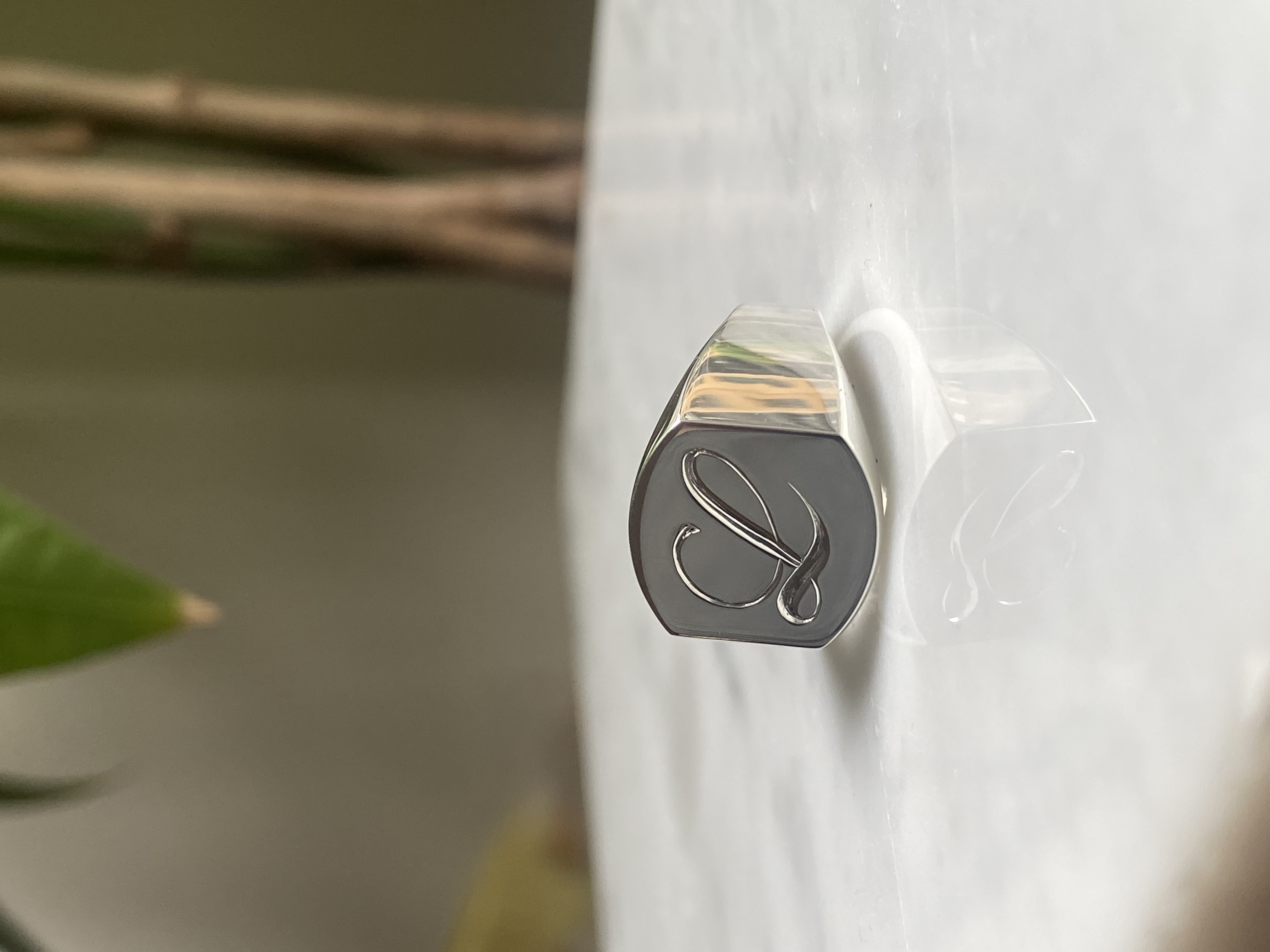Cursive L monogram hand-engraved signet ring with oxidized darkened face polished relief — Bear Goldsmithing Toronto