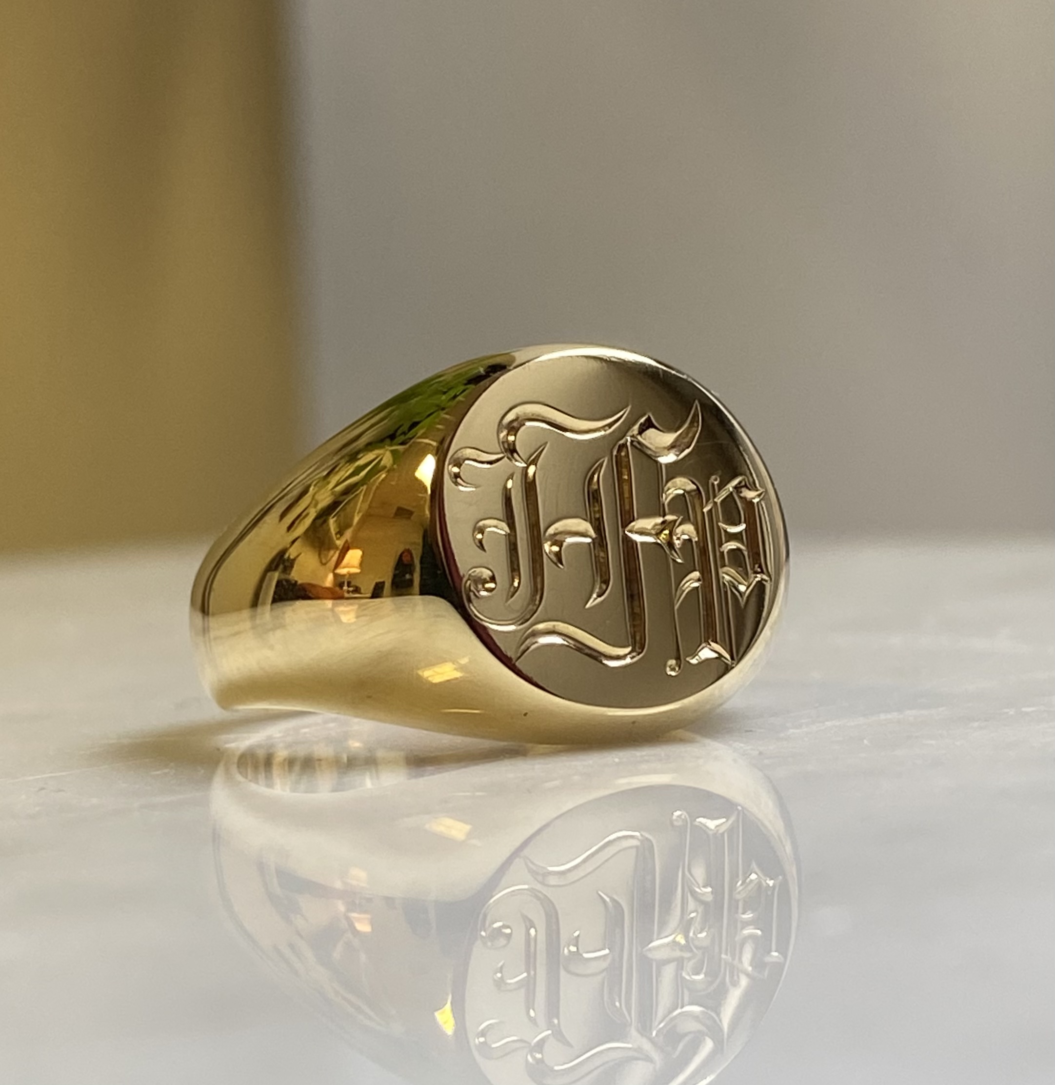Gothic blackletter monogram signet ring hand-engraved in yellow gold by Alex Bär — Bear Goldsmithing Toronto